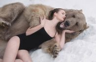 Russian Models Pose Next To Brown Bear