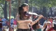 The Violinist Girl Performing On The Street